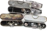 many different types of pocket knives in this picture