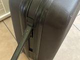 a piece of luggage sitting on the floor next to a wall