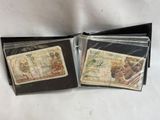two different types of currency are in a wallet on a white surface