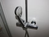 a shower head with a shower hose attached to it