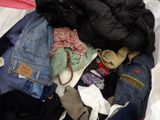 a pile of clothes that is sitting in a bag