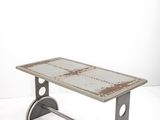 an image of a bench made out of a piece of metal