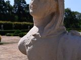 a statue of a woman that is sitting on a table