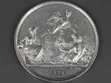 a silver coin with a picture of a woman on a horse