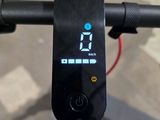 a close up of a bike handlebar with a clock on it