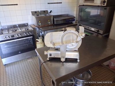 a kitchen with a stove, oven, microwave and other appliances in it