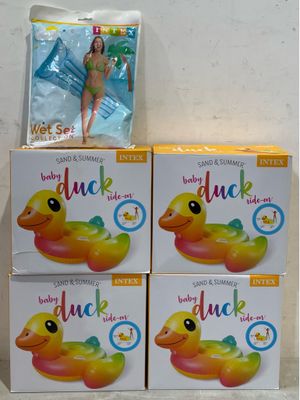 three boxes of baby duck inflatables are stacked on top of each other