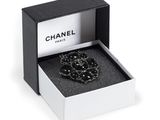 a close up of a box with a necklace in it