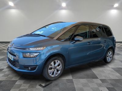 the blue citrole is parked on a checkered tile floor