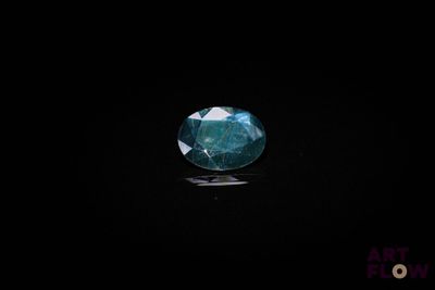 a blue diamond on a black background
