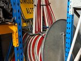 a rack with many different types of hoses on it