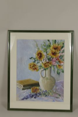 a picture of a painting of sunflowers in a vase on a table