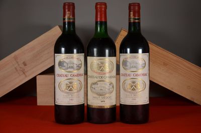 three bottles of wine sitting next to each other on a table