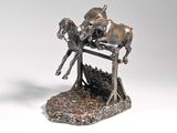 a bronze statue of a horse and a man on a horse