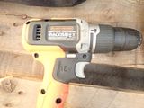a cordless drill that is sitting on a piece of wood