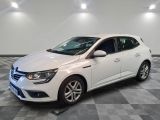 a white car is parked in a room with a checkered floor