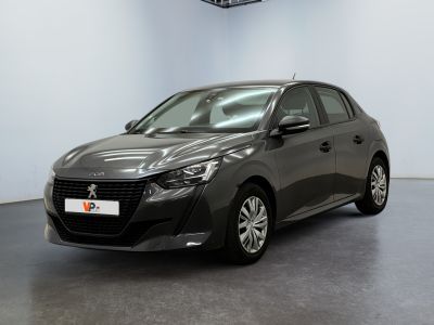 the grey car is parked in a large room with a ceiling fan