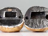 two pieces of metal that are sitting on a table