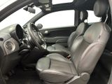 the interior of a car with leather seats and a steering wheel
