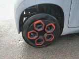 a close up of a tire on the side of a car