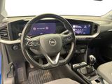 the interior of a car with a steering wheel, dashboard, and dashboard controls