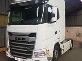 a white truck that is parked inside of a building