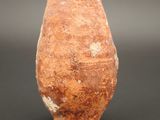 an image of a clay vase on a black surface