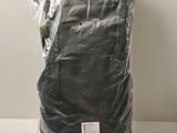 a close up of a bag of black cloth on a table