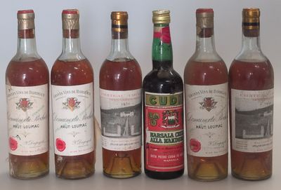 several bottles of wine are lined up on a table