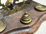 a clock that is sitting on top of a wooden table