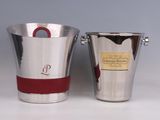 two silver and red buckets with handles sitting next to each other