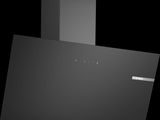 a close up of a black stove top oven with a black background