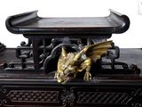 a statue of a dragon sitting on top of a table