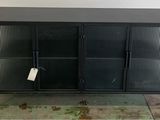 an image of a black metal cabinet with two doors and a tag on it