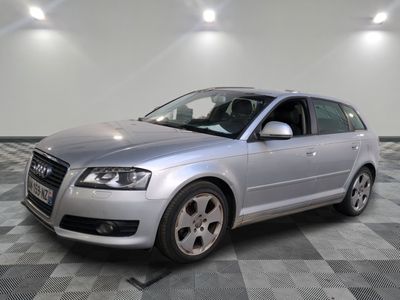 an image of a silver car parked in a garage