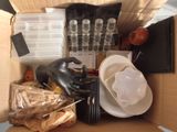 a box full of assorted items and a statue of a horse