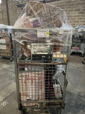 a cart with a lot of items in it on the street