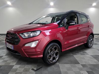a red ford eco - pace suv parked in a showroom