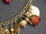 a close up of a necklace with charms on it