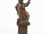 an image of a statue of a man sitting on top of a wooden box