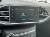 the dashboard of a car with a digital display in the center of it