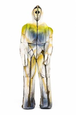 a statue of a man that is standing in front of a white background
