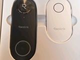 two remote controls in a box on a table