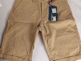 men ' s khaki shorts with a tag on the side