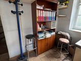 an image of a room with a desk and shelves