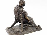 bronze statue of a woman and a dog on a stone base
