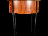 a small table with a wooden top and black legs