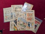 une pile de vieux journaux français par terre