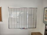a white board on the wall in a room