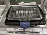 une photo d'un barbecue exposé dans un magasin